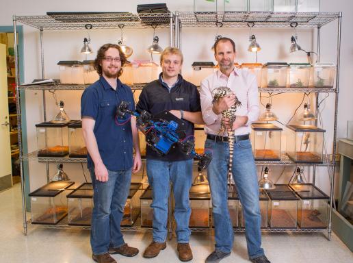 From left, Dylan Briggs, Kasey Smart, two seniors, and Duncan Irschick, a biology professor, with the Beastcam, and a lizard.