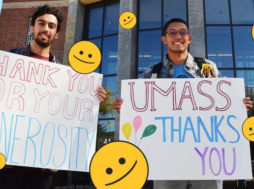 Students holding signage thanking donors with phrases like, "Thank you for your generosity" and "UMass thanks you"