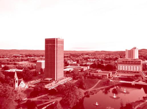 Red duotone image of aerial of UMass Amherst