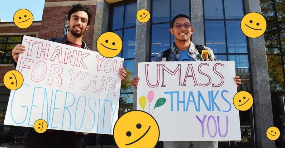 Students holding signs thanking donors for their generosity